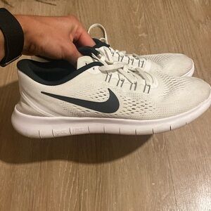 White and black Nike Free Runs